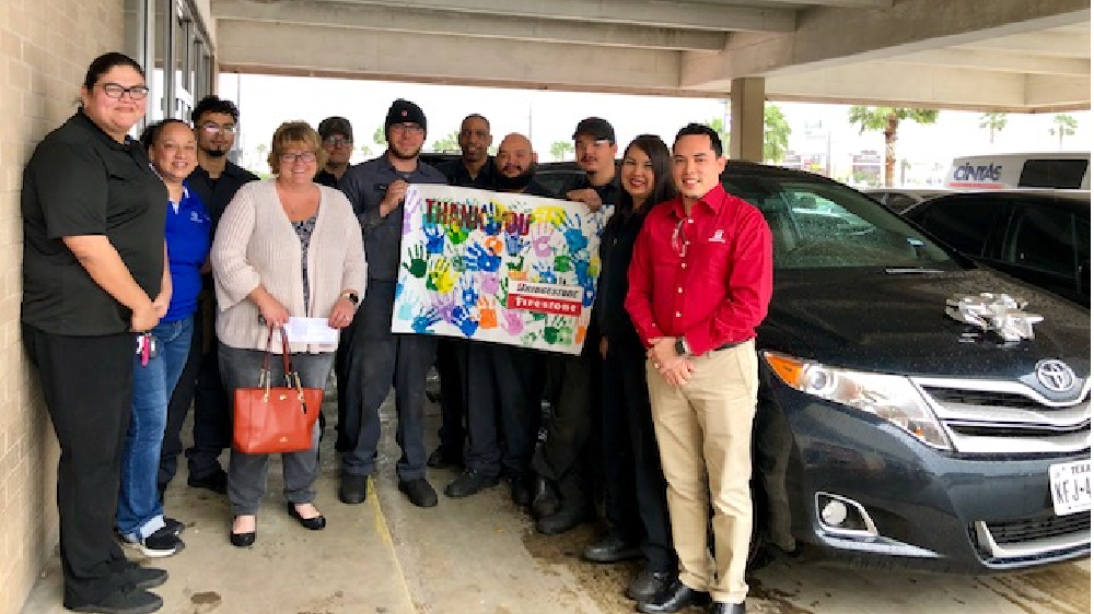 Firestone complete auto care center with members of boys and girls clubs of america in Texas